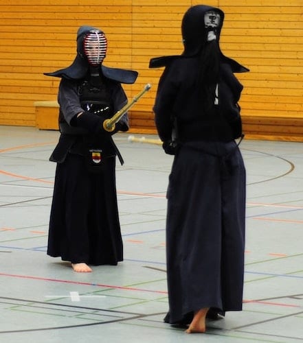Two People Practicing Kendo