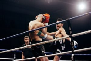 Kickboxer hitting opponent in ribs